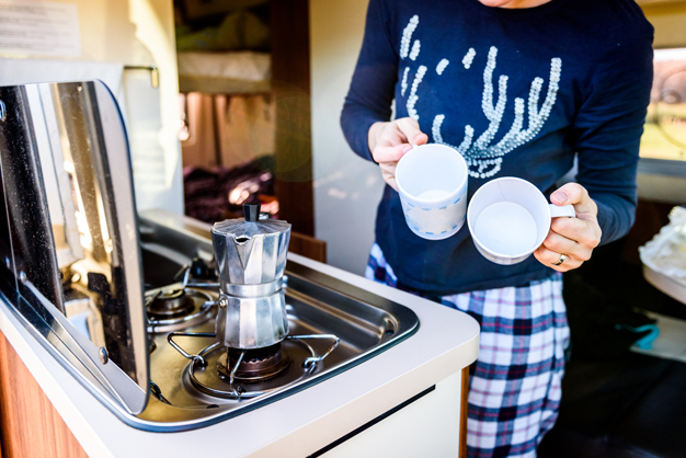 Preparing coffee in a camper van