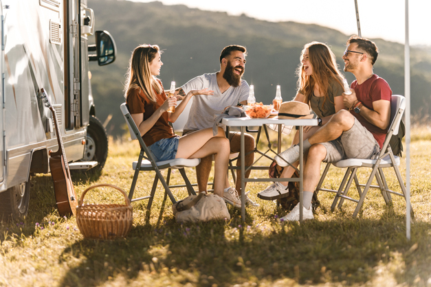 Friends gathering outside of the camper van